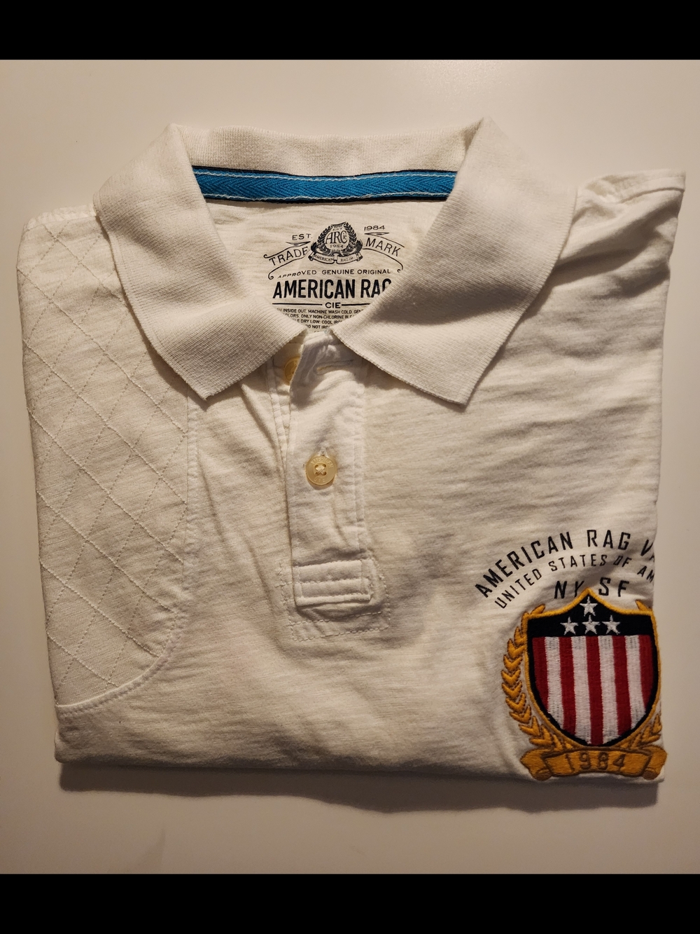 American Rag Varsity Men’s Cream Polo Shirt with Crest